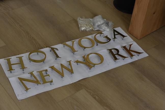 A sign awaits installation at Hot Yoga New York in Florida, NY, a couple weeks before the studio opened.