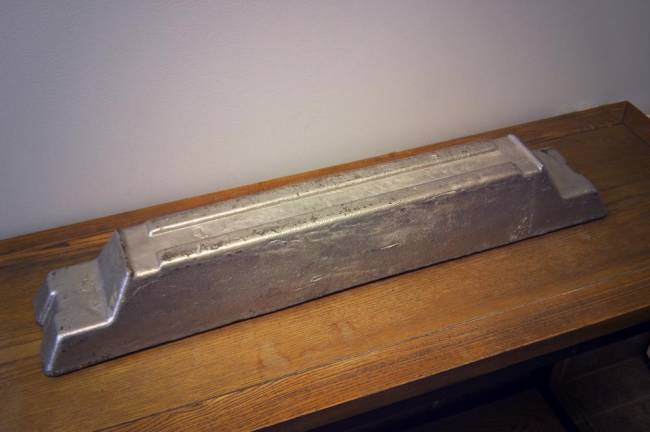 This three-foot-long bar of smelted metal was once hard drives.