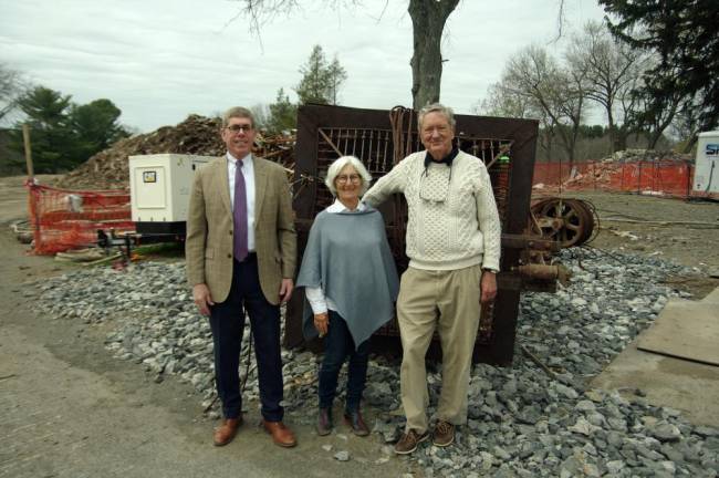 Ann Gifford with George Whalen (left) and Charlie Pierce of the Millbrook Community Partnership in front of an elevator salvaged from Bennett to be restored.