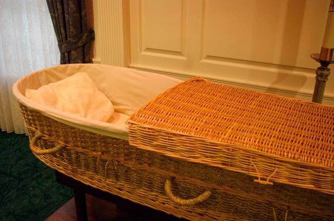 A wicker casket on display at M. John Scanlan Funeral Home in Pompton Plains, NJ, a fourth generation funeral home that offers conventional and green services.