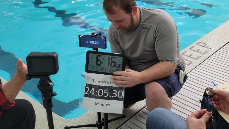 Scelba sets up for the Guinness World Record attempt in January at the Boys &amp; Girls Club of Passaic.