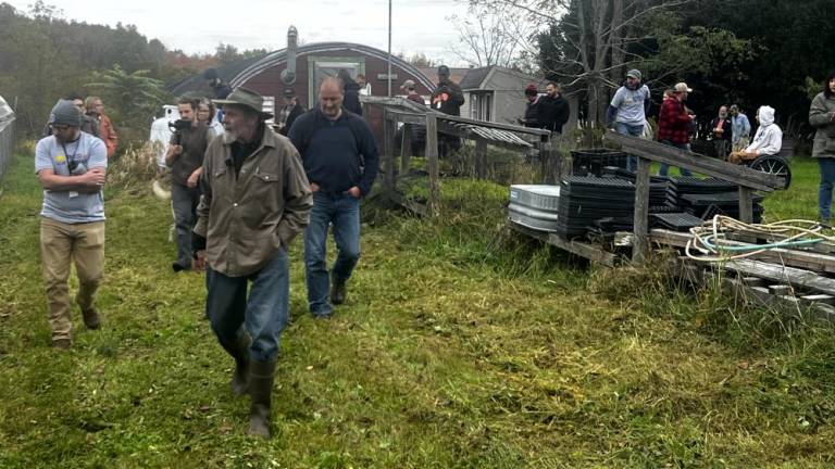 Farmer and writer Keith Stewart shows a group of veterans around his Greenville, NY organic farm in October as part of an Armed to Farm field trip.
