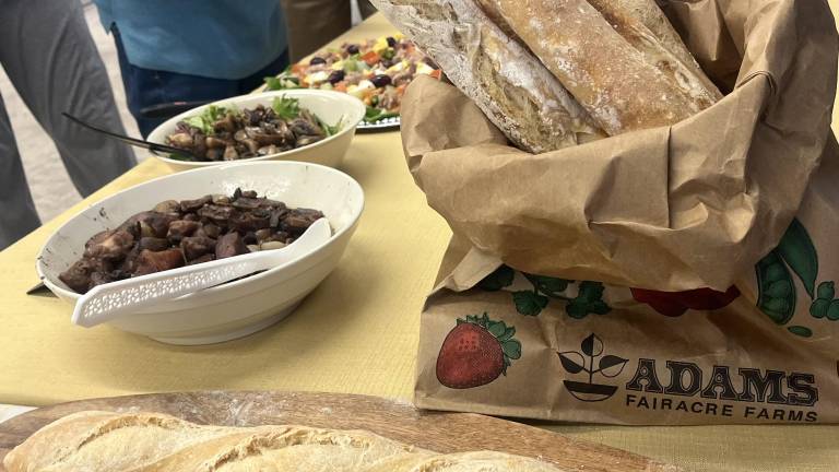 The writer’s homemade bread alongisde some of the other dishes at the last cookbook club meeting.